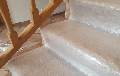 Treppenschutzvlies 0,65m x 50m  Vliesseite klebend | VPE 1 Rolle